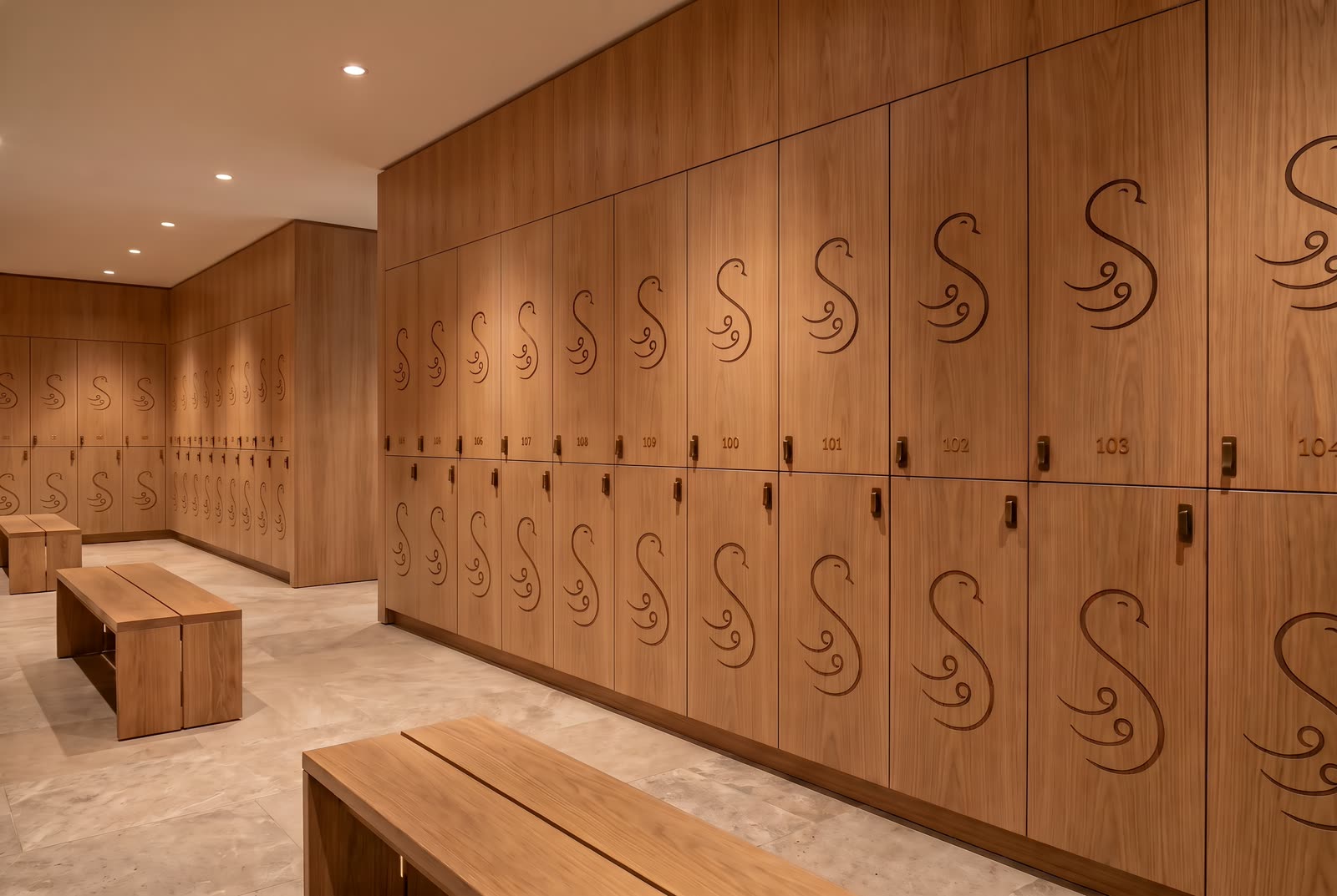 Wooden lockers, each with the swan carved in its door
